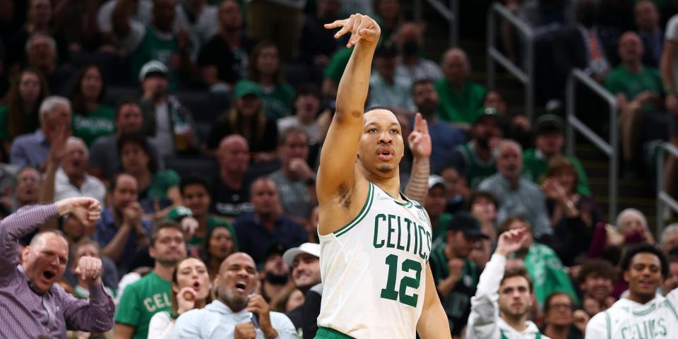 Grant Williams shoots a 3-pointer against the Bucks in Game 7.