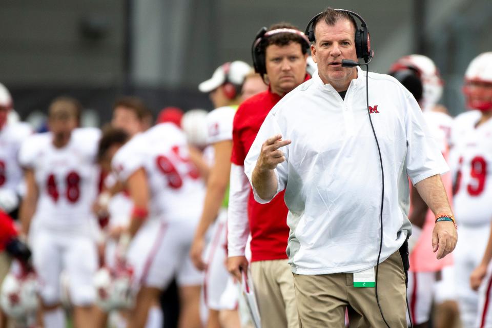 Miami Redhawks head coach Chuck Martin speaks to the referee in the second half of the NCAA football game on Saturday, Sept. 4, 2021, at Nippert Stadium in Cincinnati. Cincinnati Bearcats defeated Miami Redhawks 49-14. 