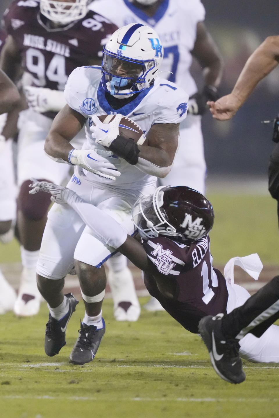 Kentucky running back Ray Davis (1) runs through an attempted tackle by Mississippi State's Corey Ellington during the first half of an NCAA college football game in Starkville, Miss., Saturday, Nov. 4, 2023. (AP Photo/Rogelio V. Solis)