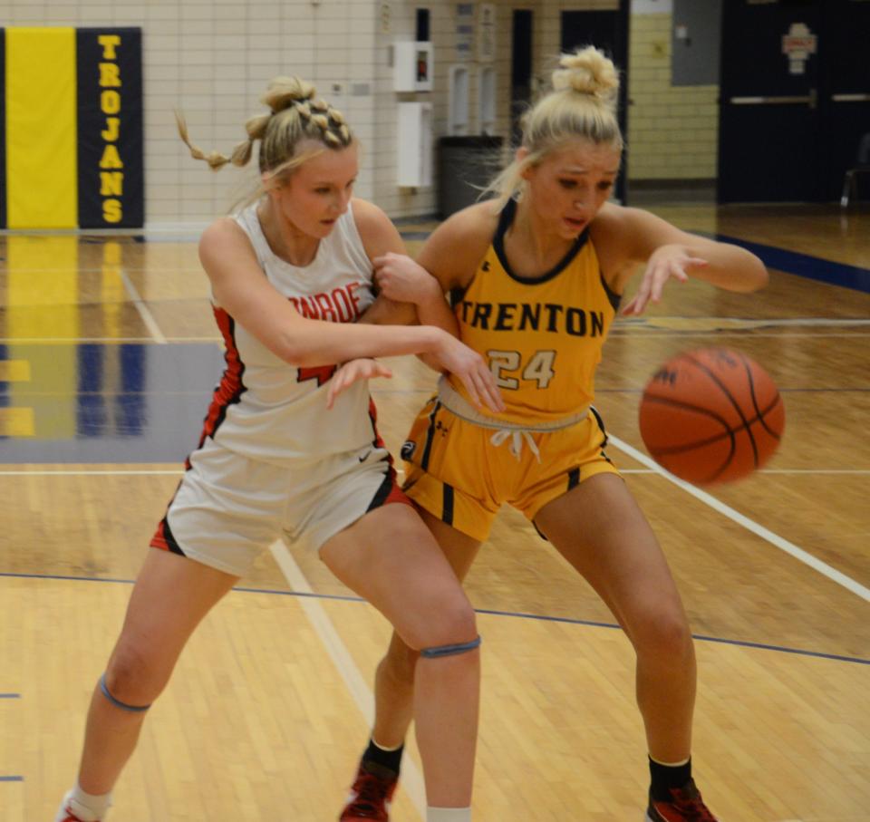 Monroe's Jillian Roberts and Brianna Thomas of Trenton battle for a loose ball during the semifinals of the Division 1 District at Trenton Wednesday.