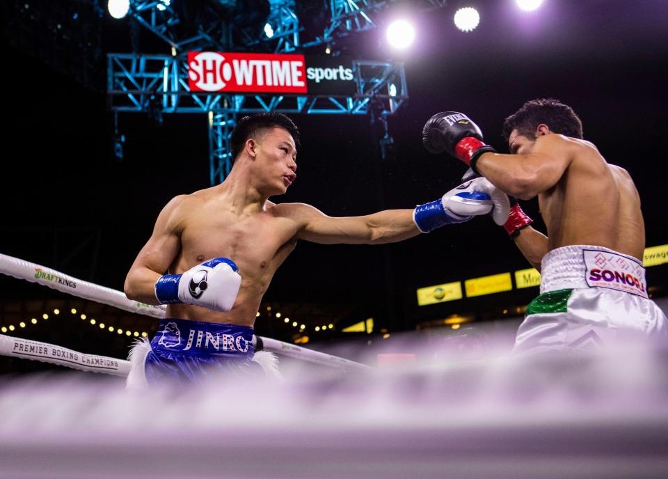 Brandun Lee reaches for a hit on Pedro Campa during their super lightweight fight at Dignity Health Sports Park in Carson, Calif., Saturday, April 8, 2023. 