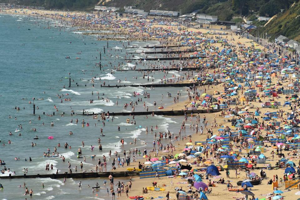 People on Bournemouth beach (AFP via Getty Images)