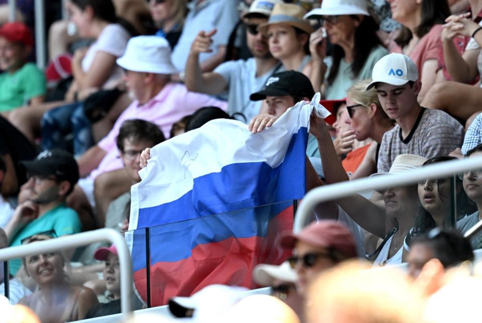 A Russian flag is displayed by spectators at the Australian Open (EPA)