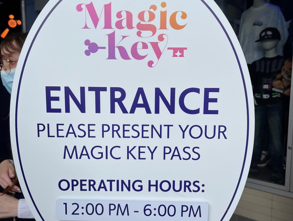 signage for the magic key entrance at disneyland