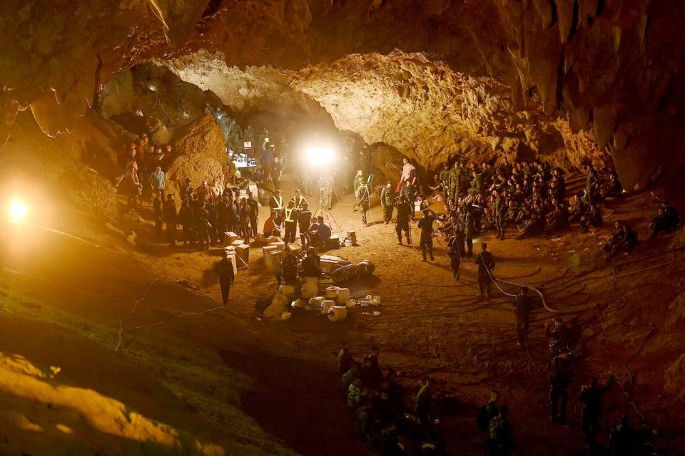 Thai soldiers relay electric cable deep into the Tham Luang cave at the Khun Nam Nang Non Forest Park in Chiang Rai