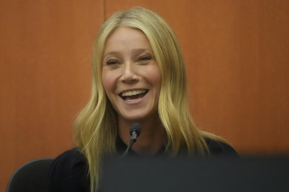 Close-up of Gwyneth smiling in court