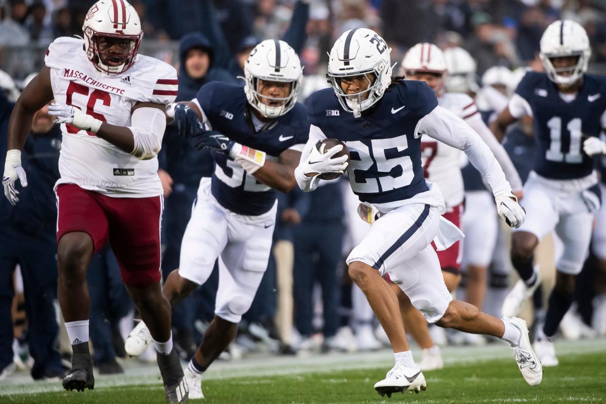 Penn State's Daequan Hardy (25) returns a punt 56 yards for a touchdown during the first half of a NCAA football game against Massachusetts Saturday, Oct. 14, 2023, in State College, Pa.