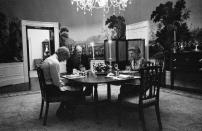 <p>President Gerald R. Ford, First Lady Betty Ford, and their son, Steven Ford, say grace prior to eating dinner in the President's dining room on the second floor of the White House Executive Residence on August 20, 1974.</p>