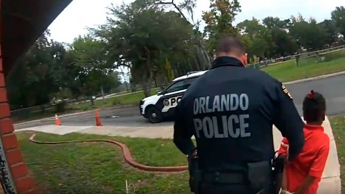 Kaia Rolle, 6, being escorted by police out of her school under arrest (Orlando Police Department)