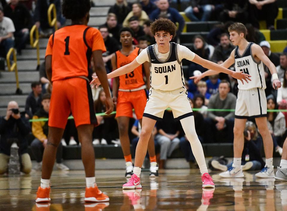 Manasquan's Darius Adams (1) goes up against Woodrow Wilson's Alijah Smith (1) during Thursday's NJSIAA Group 3 state semifinal game in Brick, N.J. The Tigers defeated Manasquan 44-39. Mar. 10, 2022.