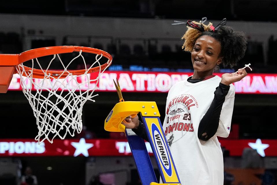 Transylvania's Dasia Thornton reacts as she cuts the net after winning tthe NCAA Women's Division 3 championship basketball game against Christopher Newport Saturday, April 1, 2023, in Dallas. (AP Photo/Darron Cummings)