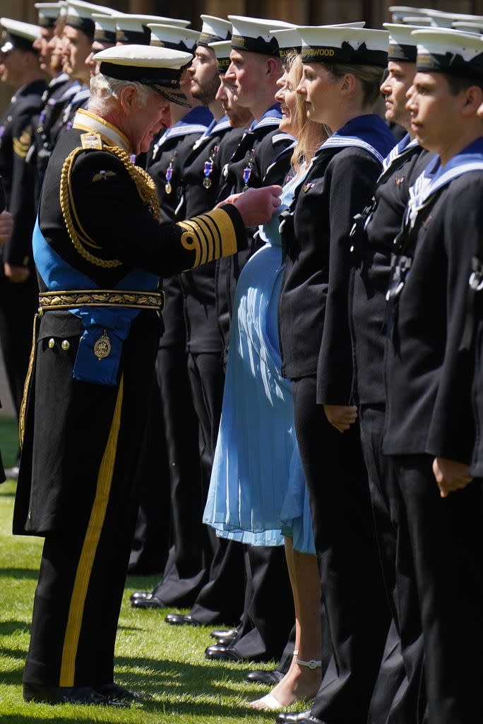 The King presents Miss Chambers-Smith with the Royal Victorian Order