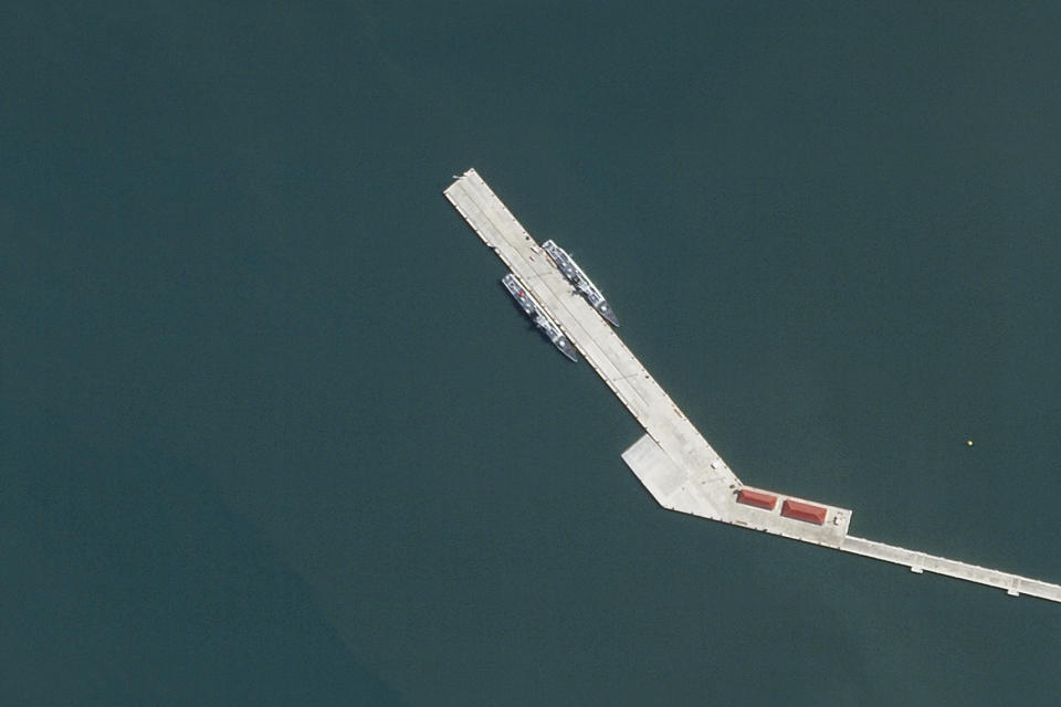 This satellite photo taken by Planet Labs PBC shows two Chinese corvettes docked at the Ream Naval Base on the Gulf of Thailand on Wednesday, May 8, 2024. Cambodia's Defense Ministry insisted Wednesday that the monthslong presence of two Chinese warships at a strategically important naval base that has been newly expanded with funding from Beijing does not constitute a permanent deployment of the Chinese military in the country. (Planet Labs PBC via AP)