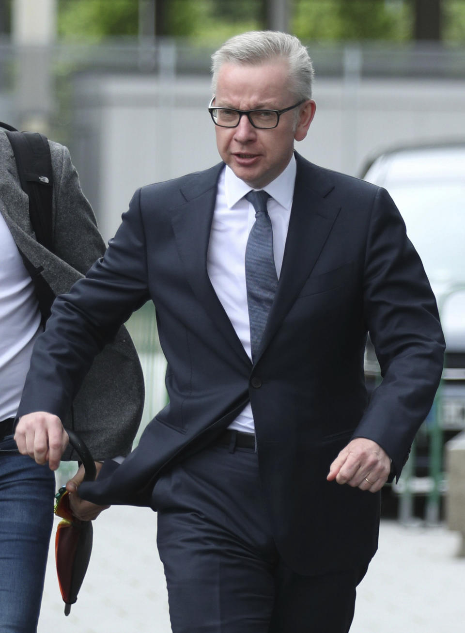 Conservative party leadership contender Michael Gove arrives at the television studios ahead of a scheduled live television debate for the Conservative Party leadership candidates, in London, Sunday June 16, 2019. Five out of the six candidates will appear in the first TV debate, with Boris Johnson declining to take part, although other candidates accuse him of trying to avoid scrutiny. (Yui Mok/PA via AP)