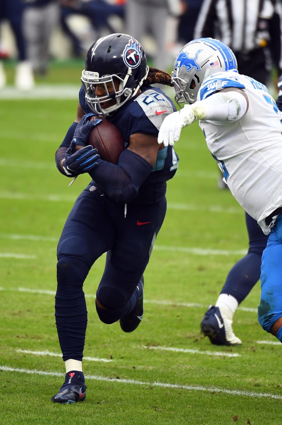 Titans running back Derrick Henry runs the ball during the first half on Sunday, Dec. 20, 2020, in Nashville, Tennessee.