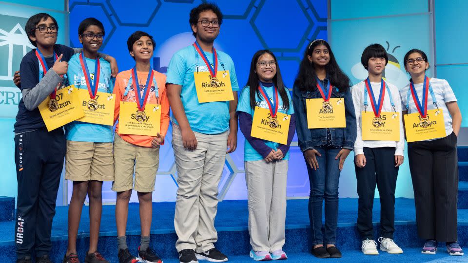 The final eight competitors of the Scripps National Spelling Bee pose for a group photograph after the conclusion of the semifinals on Wednesday. - Jacquelyn Martin/AP