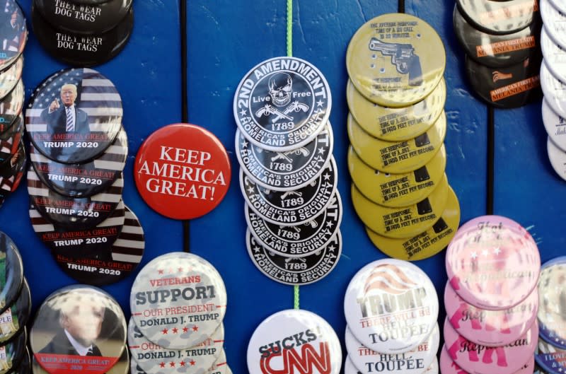 A vendor sells pins as gun rights advocates and militia members attend rally in Richmond, Virginia