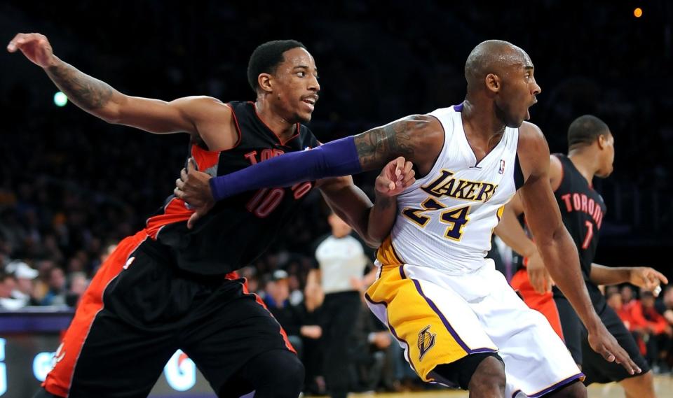 Kobe Bryant posts up against DeMar DeRozan.