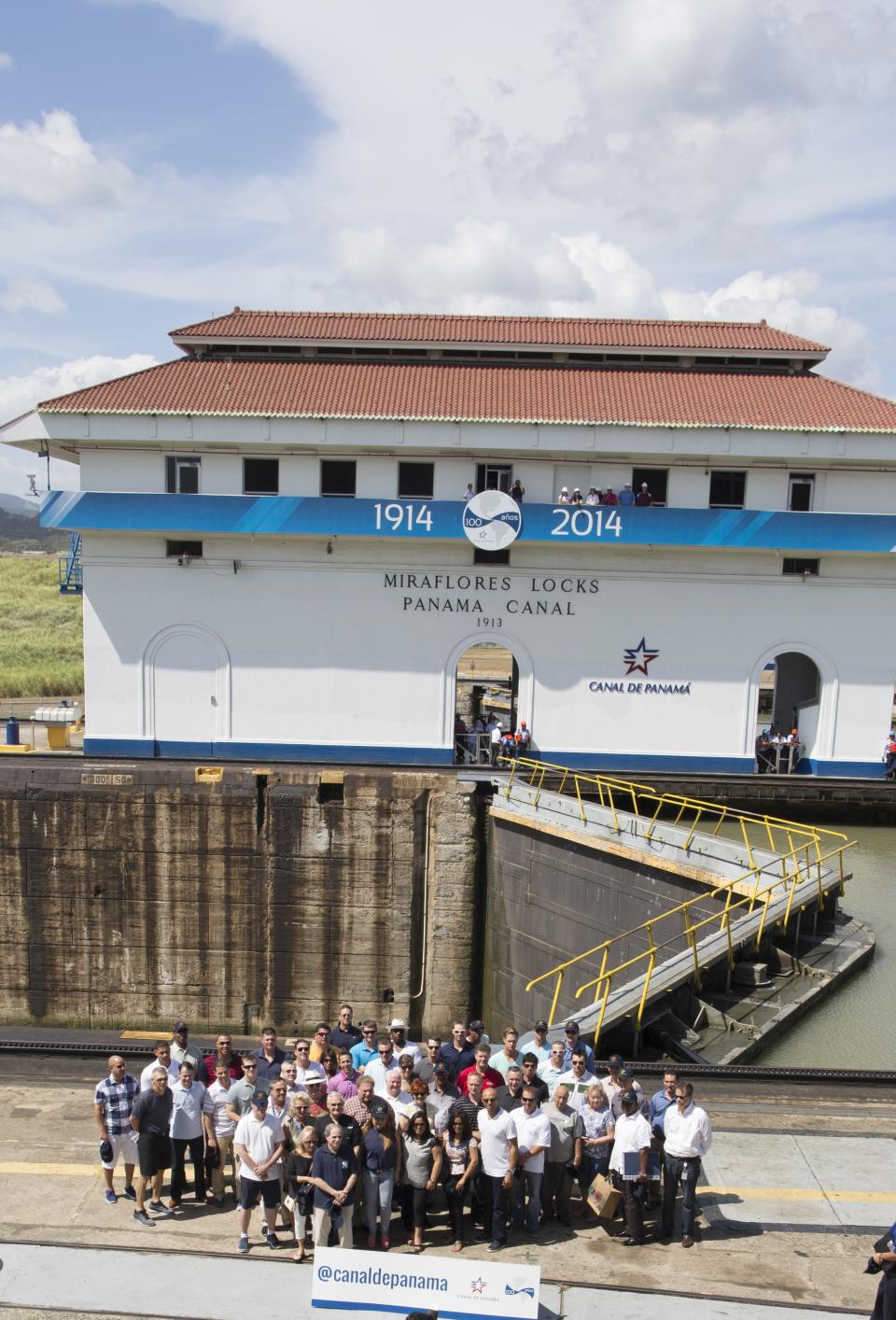 New York Yankees baseball players, staff members and companions pose for a photo during a visit to the Miraflores Locks at the Panama Canal in Panama City, Friday, March 14, 2014. The New York Yankees and the Miami Marlins will play on March 15-16, in the "Legend Series" to honor recently retired Yankees pitcher Mariano Rivera. (AP Photo/Tito Herrera)