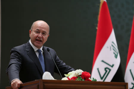 Barham Salih, Iraq's newly elected president, delivers a speech at the parliament headquarters, in Baghdad, October 2, 2018. Iraqi Parliament Office/Handout via REUTERS