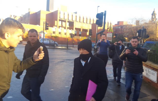 Kieran Creavan (centre) is filmed by a member of the Predator Exposure group (left) outside Leeds Crown Court (Dave Higgens/PA)