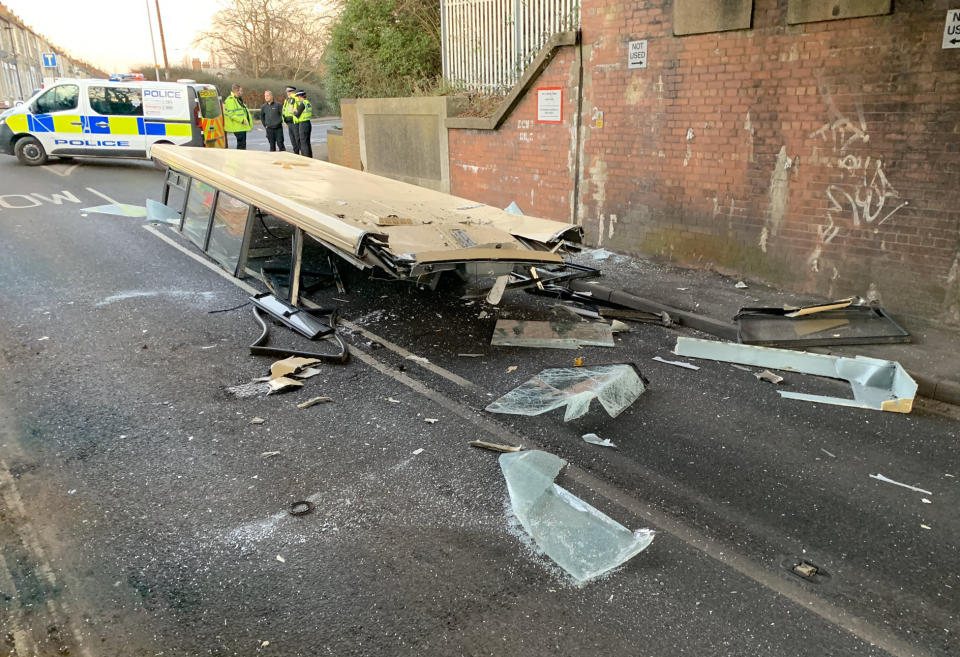 The bus roof lies on the road after being ripped off passing under a low bridge (York Press/SWNS)