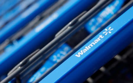 FILE PHOTO - Shopping carts are seen outside a new Wal-Mart Express store in Chicago July 26, 2011. REUTERS/John Gress/File Photo