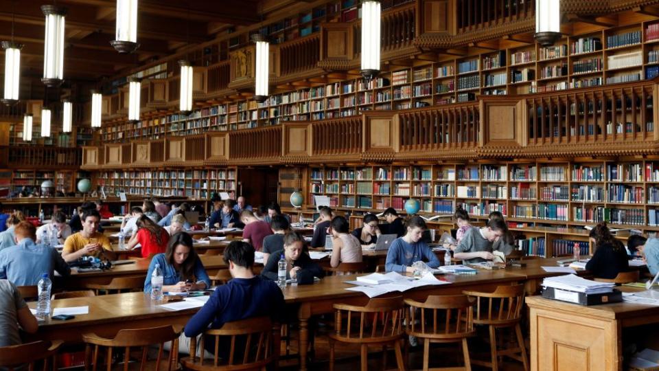 Students sit in the library