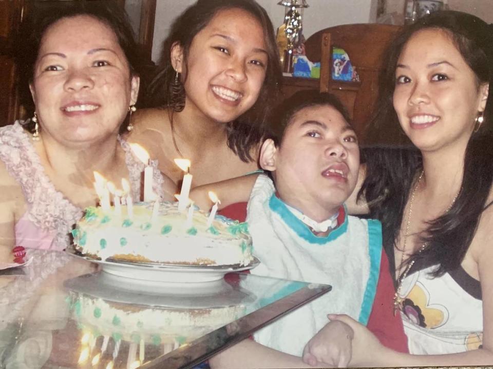 Justin Nguyen is surrounded by his mother, Julie, and his sisters Jennifer and Jessica Pham as they celebrate his 12th birthday. Every one of Justin’s birthday is a big celebration in the family as they say they never know how many more years Justin will be with them.