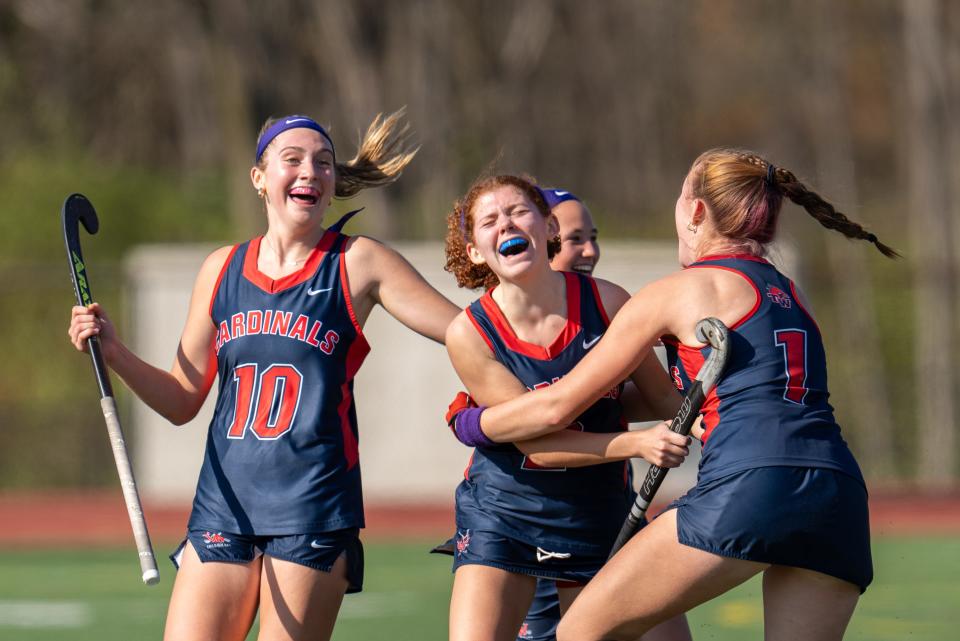 Thomas Worthington's Sophia Borghese, center, celebrates with her teammates after scoring the winning goal in Saturday's state championship game.