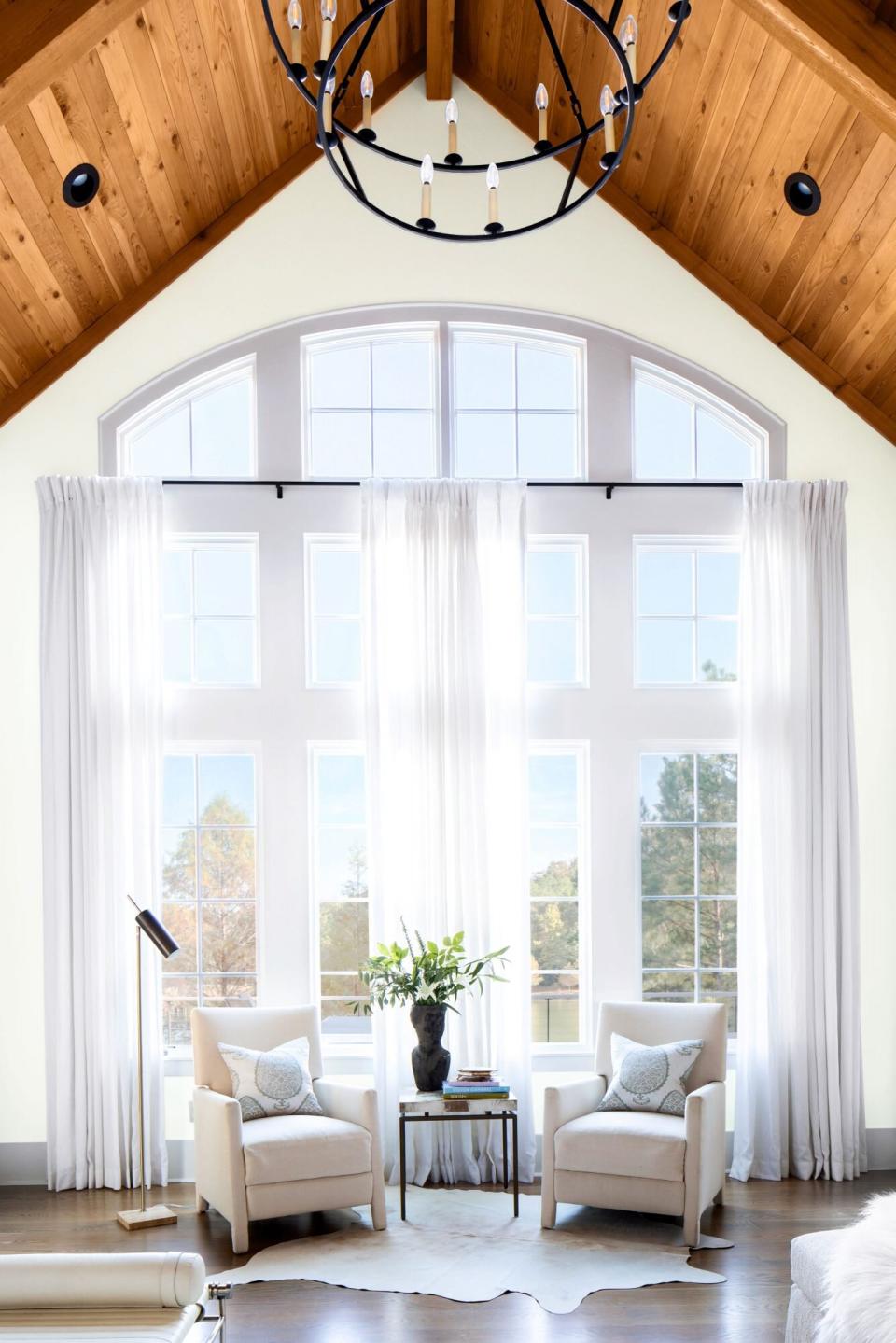 Cabin with White Walls and Floor to Ceiling Windows