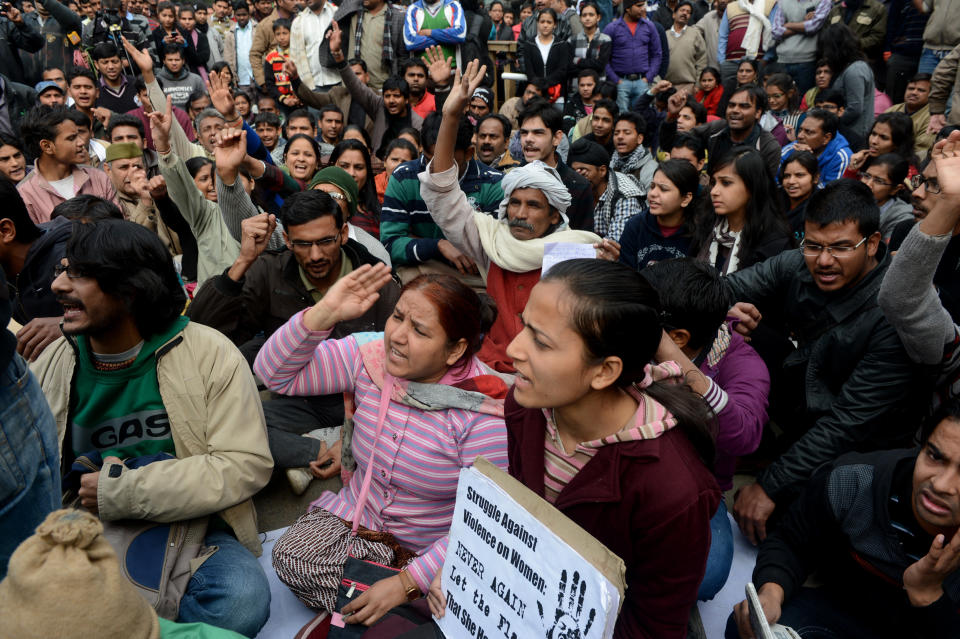 Indian residents shout anti-government slogans as they take part in a protest in New Delhi on December 30, 2012, after the cremation ceremony for a gangrape victim. (RAVEENDRAN/AFP/Getty Images)