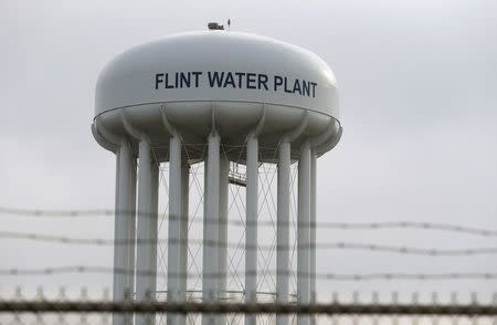 The top of the Flint Water Plant tower is seen in Flint, Michigan in this February 7, 2016 file photo. A group of Flint families with children has filed new lawsuits in the Michigan city's water crisis, accusing private companies of professional negligence and government employees of misconduct that led to the contamination of the water supply. REUTERS/Rebecca Cook/Files