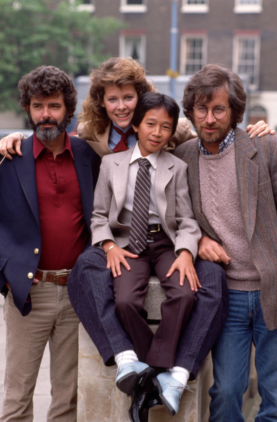 Film director Steven Spielberg, right, poses for a photograph with, left to right, Executive producer George Lucas, Actress Kate Capshaw, and Actor Ke 'Jonathan Huy Quan, to promote their new film 'Indiana Jones and the Temple of Doom'