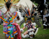 <p>Revellers perform a dance during a “pow-wow” celebrating the Indigenous Peoples’ Day Festival in Randalls Island, in New York, Oct. 8, 2017. (Photo: Eduardo Munoz/Reuters) </p>
