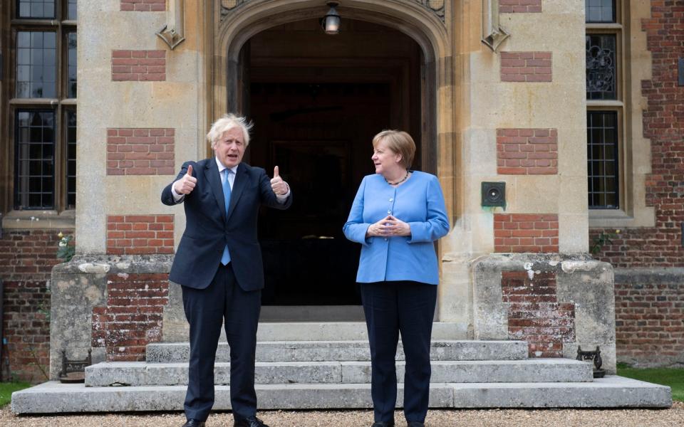 Boris Johnson with then German Chancellor Angela Merkel at Chequers in July 2021 - David Rose