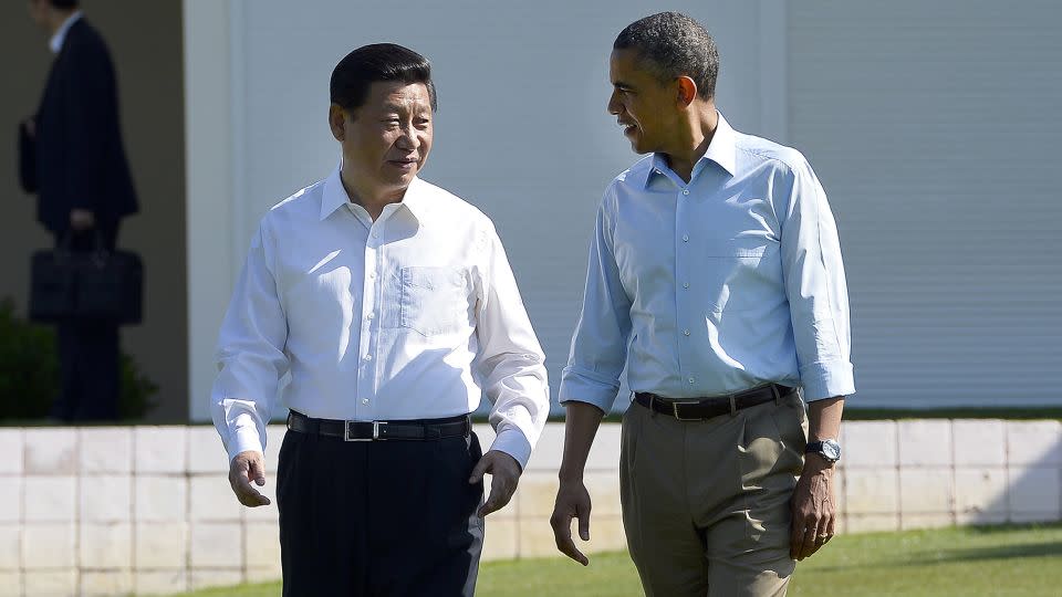 Former US President Barack Obama and Chinese leader Xi Jinping chat as they take a walk at the Annenberg Retreat at Sunnylands in Rancho Mirage, California, on June 8, 2013. - Jewel Samad/AFP/Getty Images