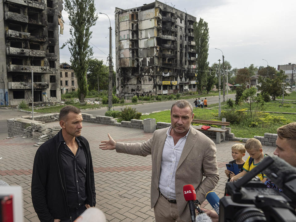 American actor and   co-founder of Blue Ukraine Liev Schreiber (alongside former striker and coach of the Ukraine national soccer team Andriy Shevchenko) speaks to media in front of homes destroyed by Russian bombardment in Borodianka, near Kyiv, Ukraine, on Aug. 15, 2022. / Credit: Evgeniy Maloletka/AP