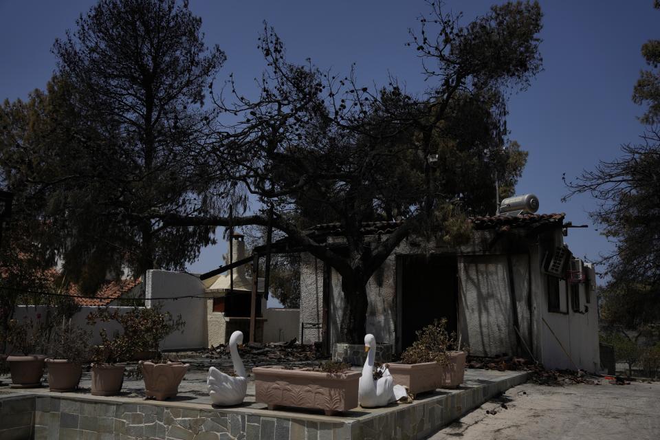 The burned out home of retiree Chrysoula Renieri is seen in Loutraki, about 82 kilometres (51 miles) west of Athens, Greece, Thursday, July 20, 2023. Renieri, 72, was among dozens of people who lost their home in the area as wildfires tore through hillside scrub and forests outside Athens. (AP Photo/Thanassis Stavrakis)