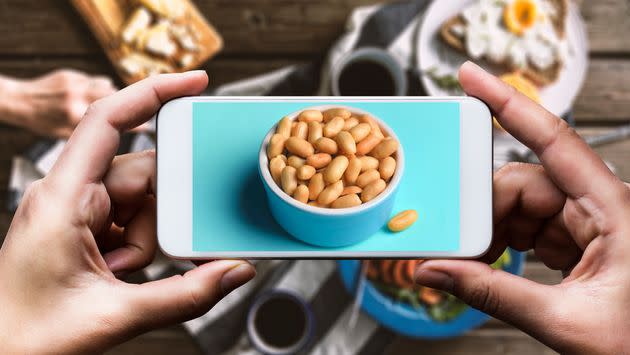 If you're not comfortable speaking the language of the place you're traveling to, always bring photos of the foods to which you're allergic. (Photo: Getty/HuffPost)