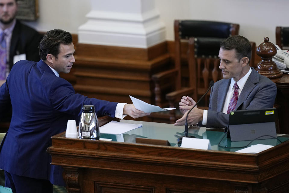 Whistleblower witness Ryan Bangert, right, is cross examined by defense attorney Anthony Osso, left, during day three of the impeachment trial for Texas Attorney General Ken Paxton in the Senate Chamber at the Texas Capitol, Thursday, Sept. 7, 2023, in Austin, Texas. (AP Photo/Eric Gay)