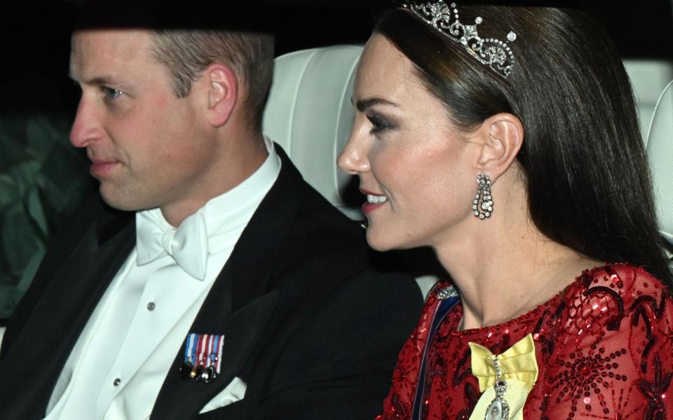 William and Kate arriving at the diplomatic reception at Buckingham Palace - PA