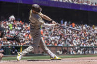 San Diego Padres' Wil Myers hits an RBI single against the San Francisco Giants during the first inning of a baseball game in San Francisco, Sunday, May 22, 2022. (AP Photo/John Hefti)