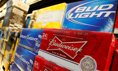 FILE PHOTO: Anheuser Busch's Budweiser and Bud Light Beer can be seen on display at a new Wal-Mart store in Chicago, U.S., January 24, 2012. REUTERS/John Gress/File Photo