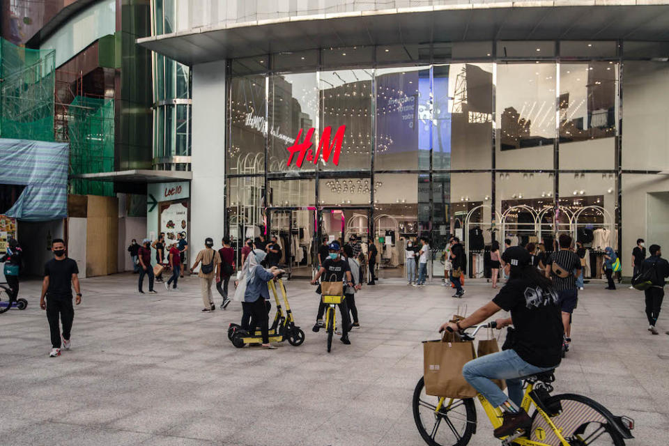 People are seen wearing protective masks as they walk along the Bukit Bintang shopping area during Phase One of the National Recovery Plan in Kuala Lumpur on September 4, 2021. — Picture by Firdaus Latif