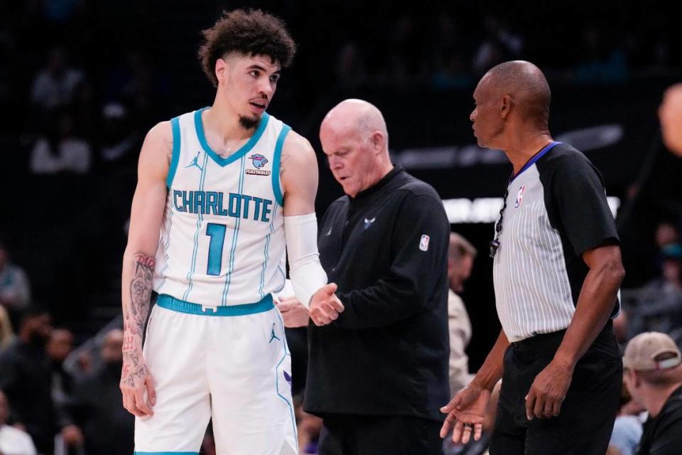 Charlotte Hornets guard LaMelo Ball (1) discusses a call with referee Michael Smith (38) during the second quarter against the Boston Celtics at Spectrum Center.