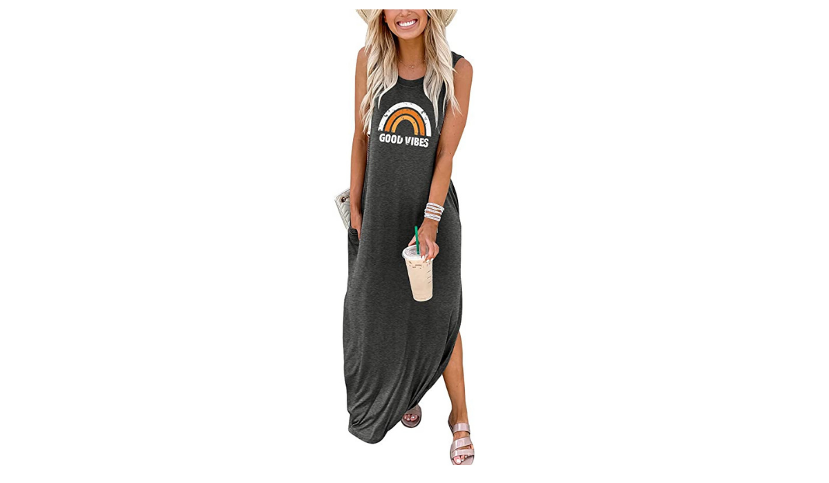 Woman wearing gray maxi dress that says Good Vibes