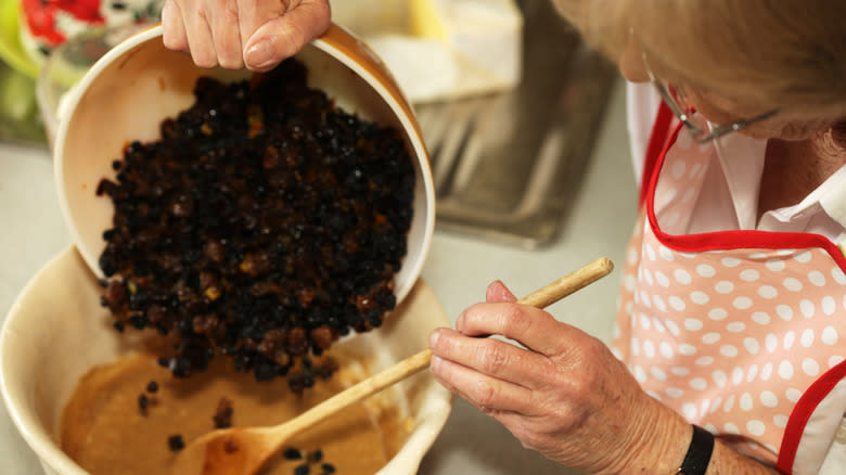 Woman making Christmas pudding