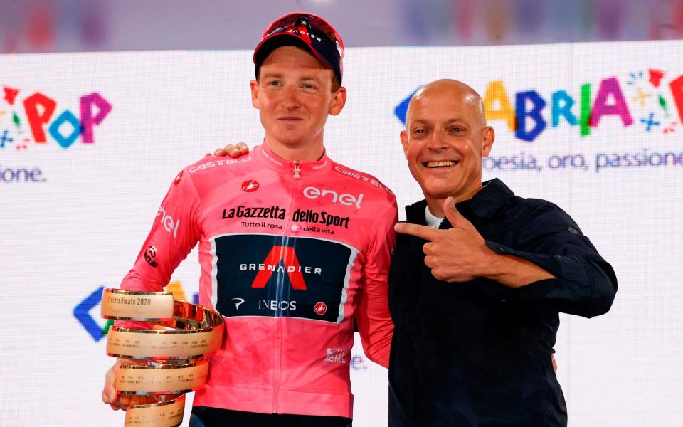 Britain's newest sporting hero Tao Geoghegan Hart with his team boss Sir David Brailsford  - AFP 