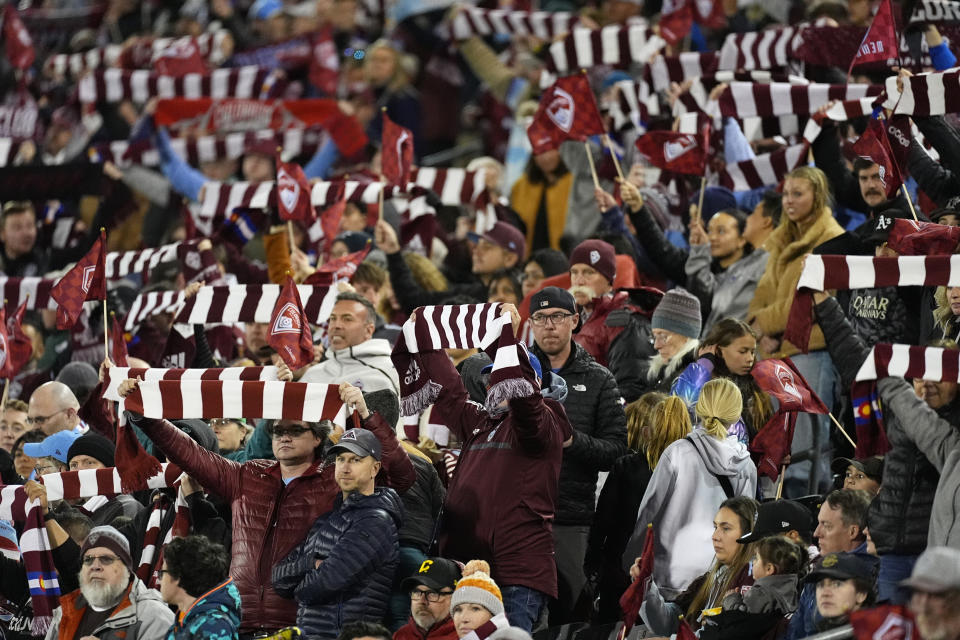 Colorado Rapids fans stand for the beginning of an MLS soccer match against Nashville SC, Saturday, March 2, 2024, in Commerce City, Colo. (AP Photo/David Zalubowski)